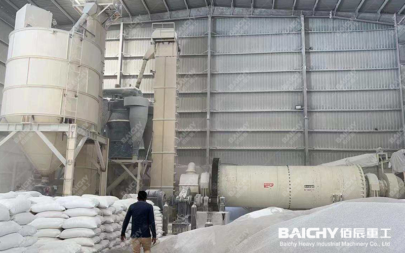 On-site view of a ceramic ball mill grinding gypsum.