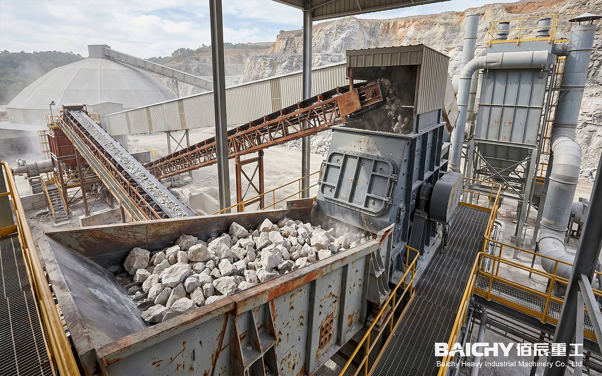 Raw material crushing and conveying system: Vibrating feeder, hammer crusher, enclosed steel-truss belt conveyor gallery, and bag-type dust collection system.